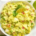 Pin of Avocado Egg Salad from the top view on a counter with title at top