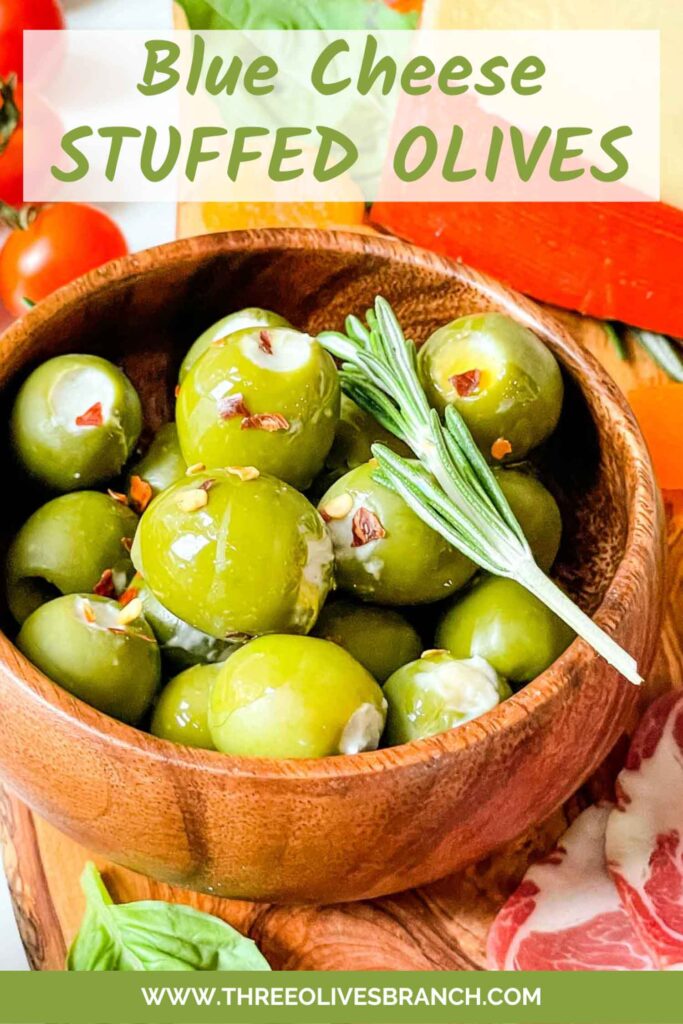 Pin of Blue Cheese Stuffed Olives in a small wood bowl with title at top