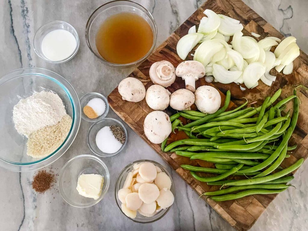 The ingredients needed for Green Bean Casserole with Fresh Green Beans sitting on a counter