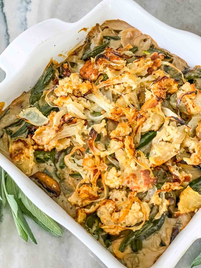 A white square dish full of Green Bean Casserole with Fresh Green Beans