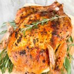 Pin of whole Italian Herb Butter Roasted Turkey with title.