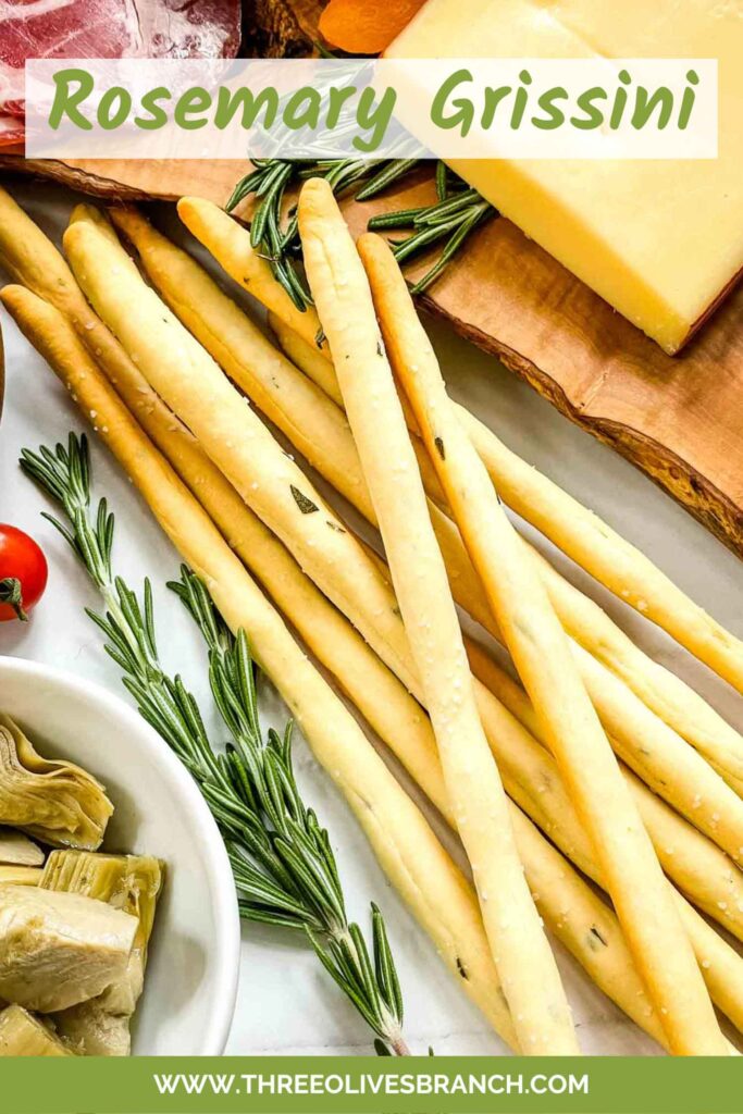 Pin of Rosemary Grissini breadsticks in a pile with title at top