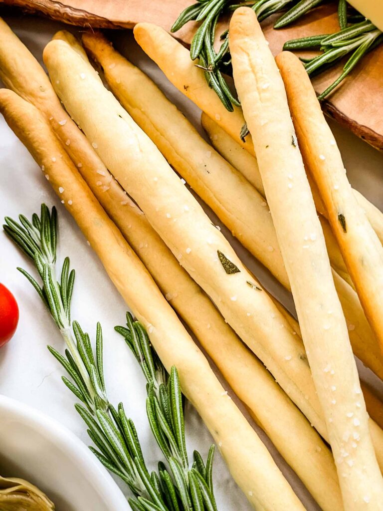 Close view of Italian Rosemary Grissini breadsticks in a pile