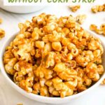 Pin of Homemade Caramel Popcorn Recipe (without Corn Syrup) in a white bowl on a counter with title at top.