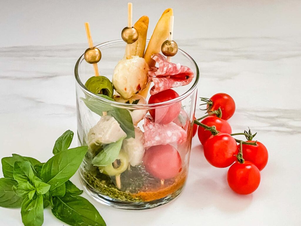 Individual Italian Charcuterie Cup with green, white, and red skewers like the Italian flag.