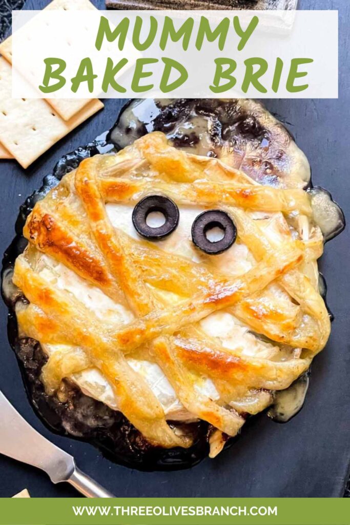 Pin of Halloween Mummy Wrapped Baked Brie Recipe with title.