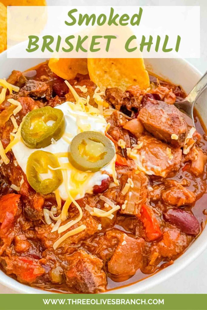 Pin of Smoked Brisket Chili Recipe in a bowl with title at top.