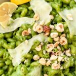 Pin of Hazelnut Spinach Pesto Cavatappi pasta up close with title at top.