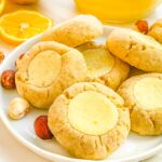 A closer view of the Italian Hazelnut Lemon Curd Thumbprint Cookies on a small plate.