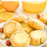 Pin of Hazelnut Lemon Curd Thumbprint Cookies with title at top.