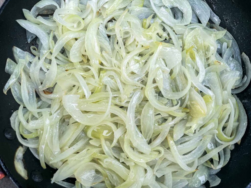 Sauteed onions in a skillet.