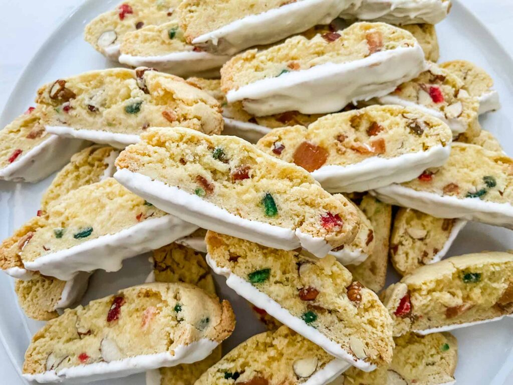 A pile of Panettone Fruitcake Biscotti on a plate.