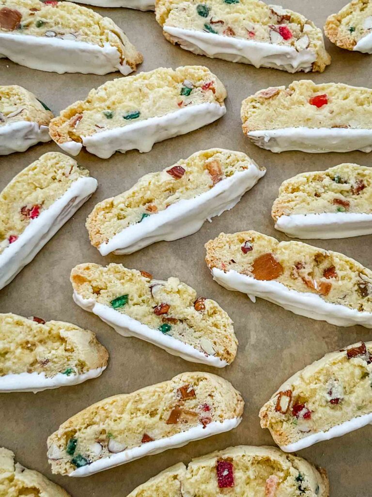 Panettone Fruitcake Biscotti scattered on a baking sheet.
