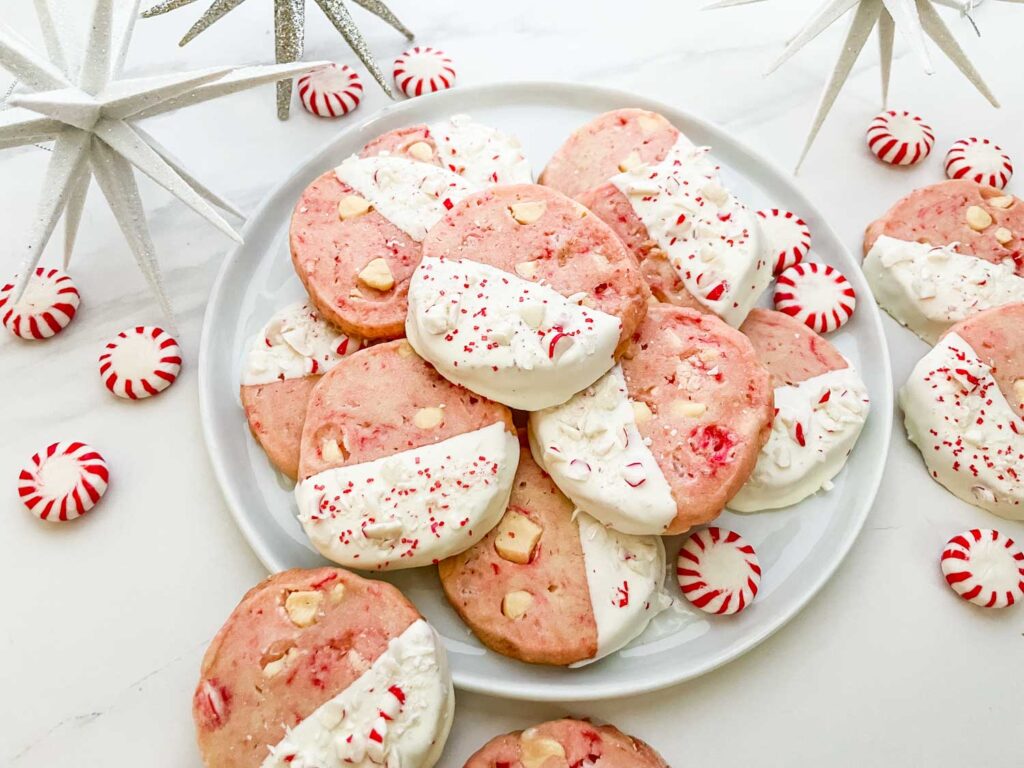 A plate of White Chocolate Peppermint Shortbread on a white counter.