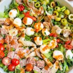 Pin of Best Italian Chopped Salad Recipe in a large bowl with title at top.