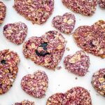 Closer view of Crunchy Berry Parfait Dog Treats spread out on a counter.