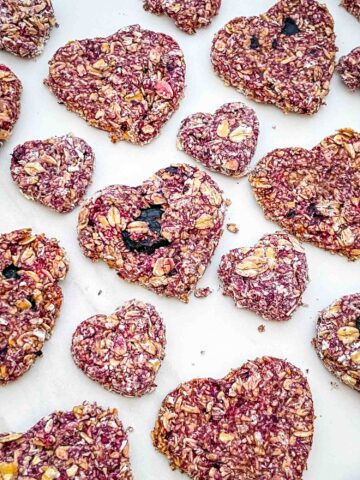 Closer view of Crunchy Berry Parfait Dog Treats spread out on a counter.