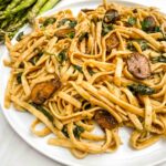 A white plate full of Mushroom Marsala Wine Sauce pasta.