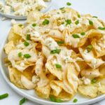 A plate of Copycat Bennigan's Blue Cheese Chips on a counter.