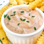 Pin of a small bowl of Homemade Chipotle Aioli Sauce with french fries around it.