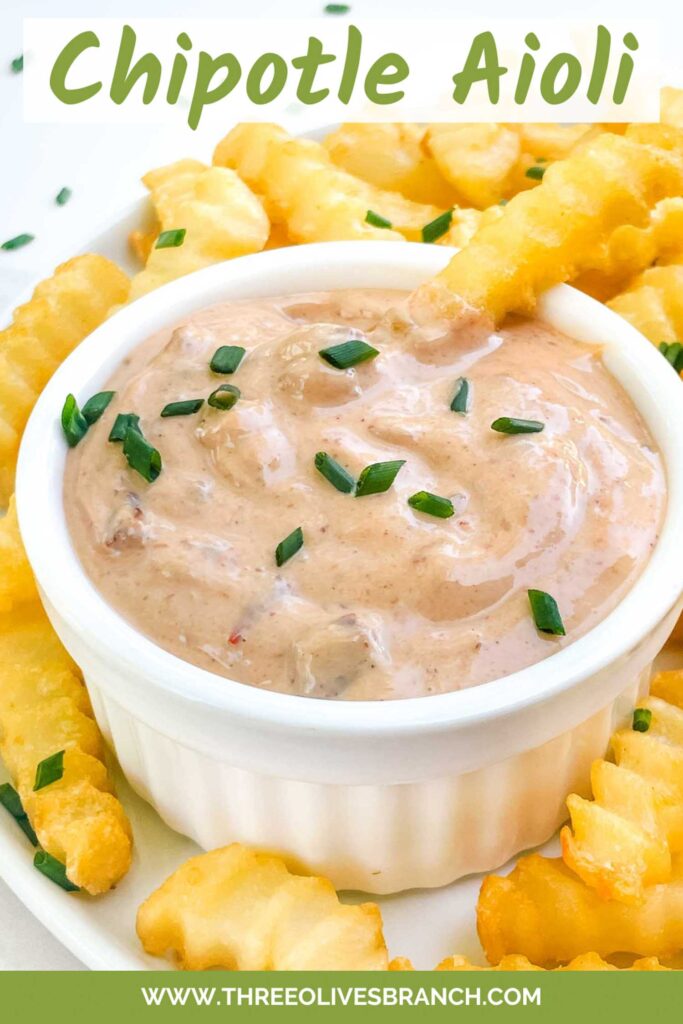 Pin of a small bowl of Homemade Chipotle Aioli Sauce with french fries around it.