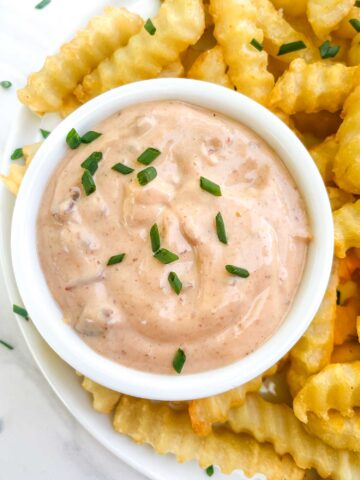 Looking down close up on a bowl of Homemade Chipotle Aioli Sauce.