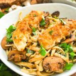A closer view of Copycat Olive Garden Chicken Marsala Fettuccine pasta in a bowl.