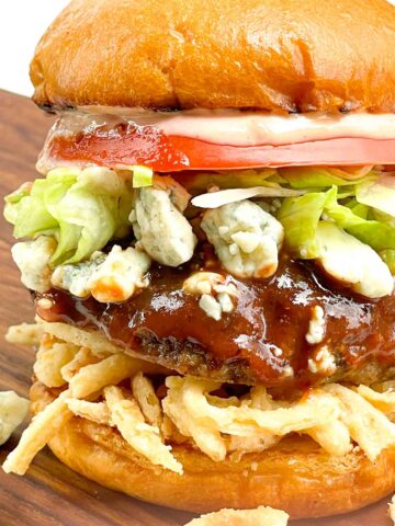 Close view of the layers of the Copycat Red Robin Bleu Ribbon Burger.