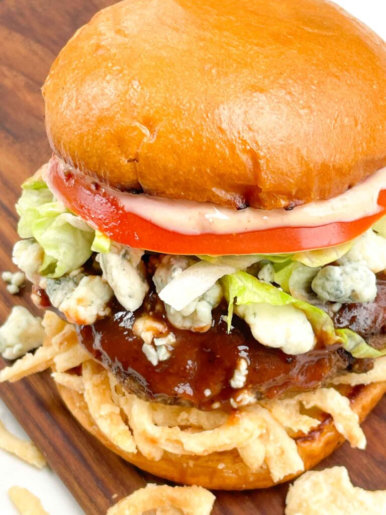 A downward looking view on a Copycat Red Robin Bleu Ribbon Burger.