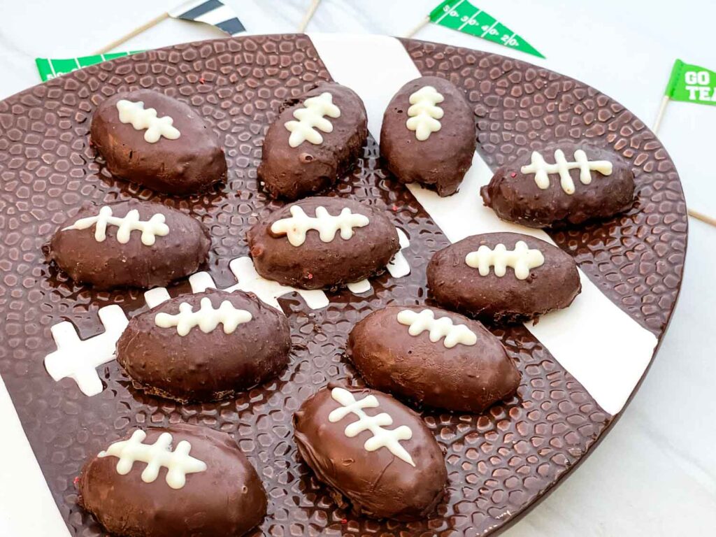 A football plate with Football Cake Pop bites on it.