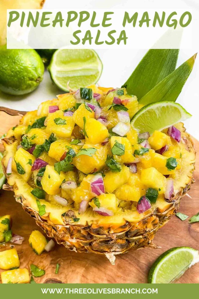 Pin looking down on a bowl made out of hollowed pineapple and full of Pineapple Mango Salsa with title at top.