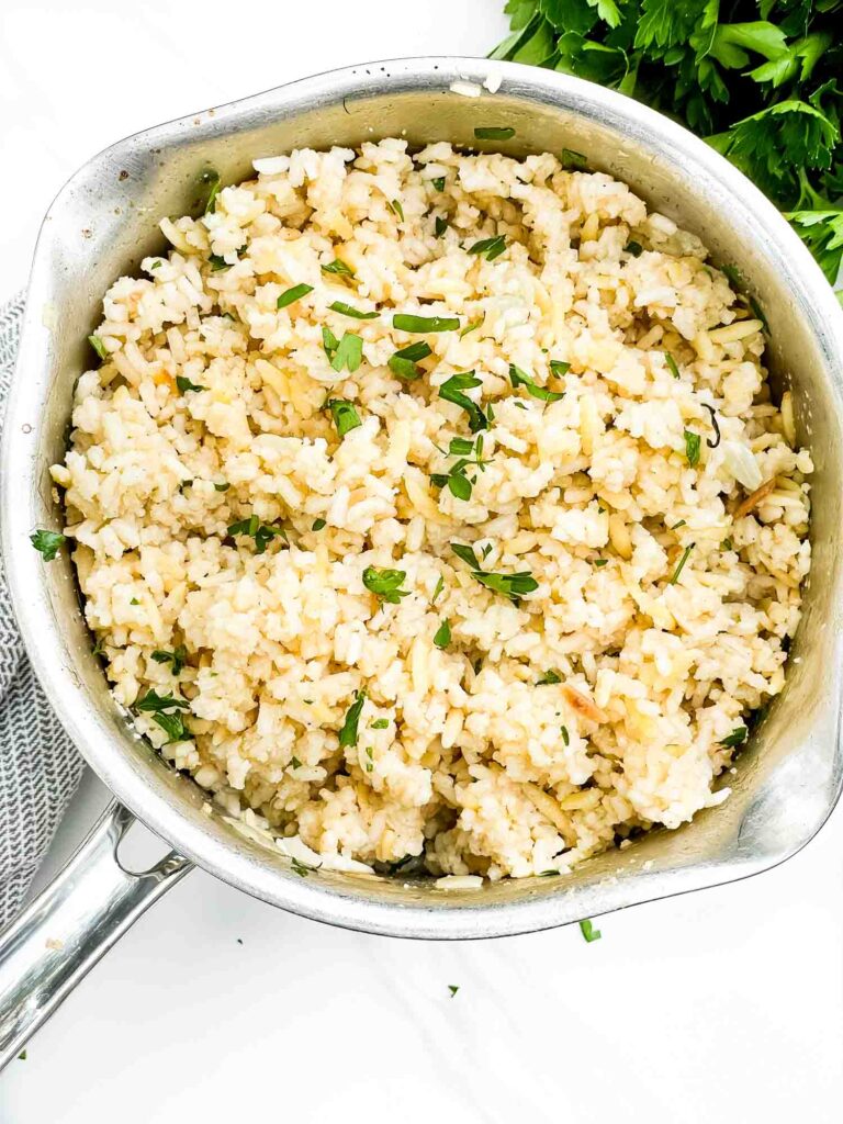 Looking down on Herbed Rice Pilaf with Orzo in a pot.