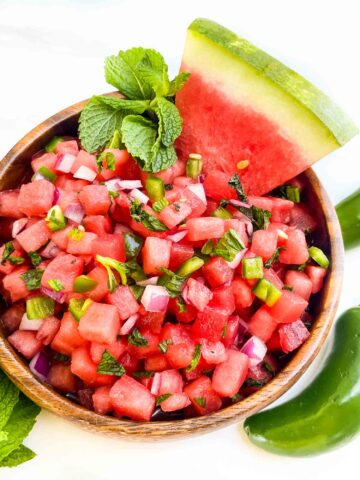 Looking down on Watermelon Salsa in a wood bowl on a counter.