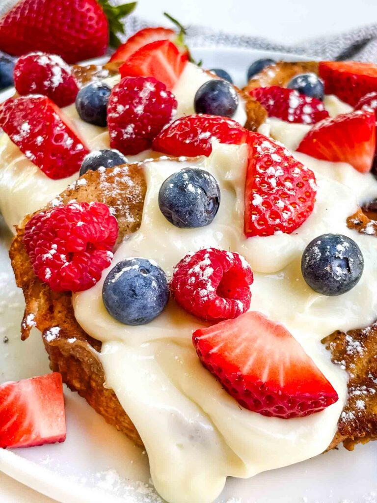 A close view of Mixed Berry French Toast on a plate.