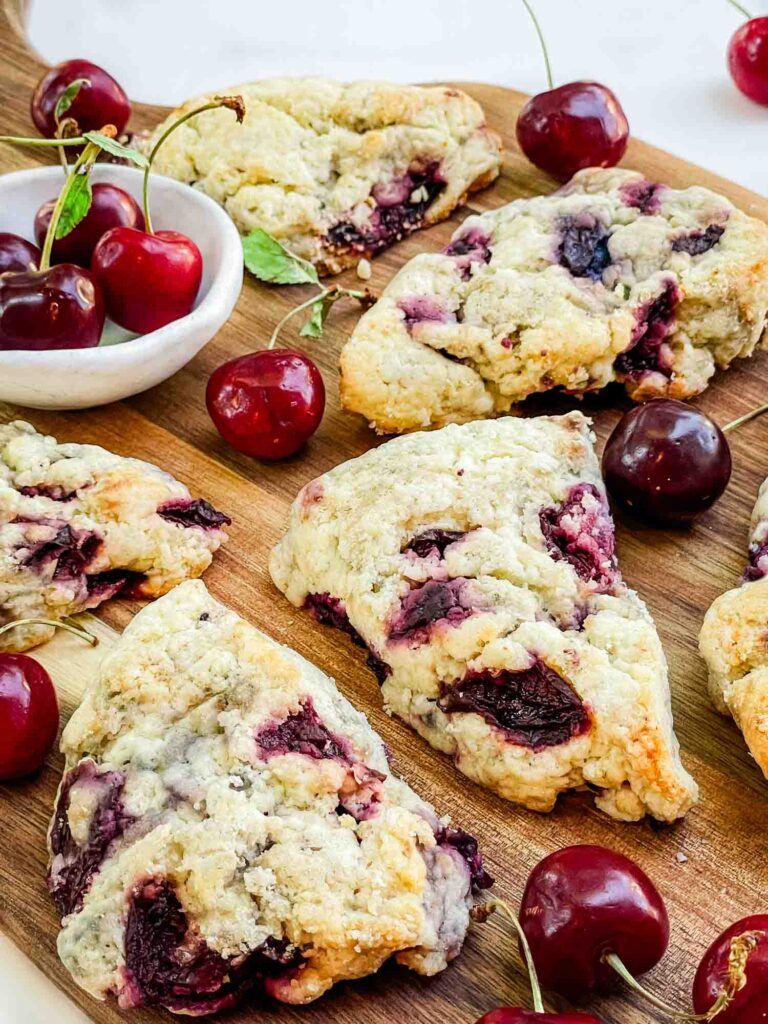 Closer view of Simple Cherry Scones on a wood board.