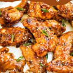 Pin of Thai Chicken Wings up close with title.