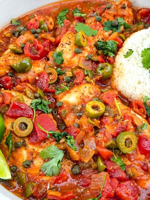 Close view of Chicken Veracruz (Pollo a la Veracruzana) in a large bowl.