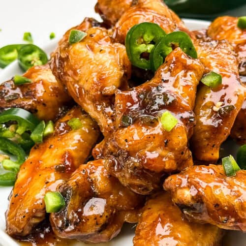 A view of Peach Jalapeno Chicken Wings in a pile on a plate.