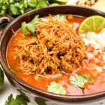 A close view of Chicken Birria (Birria de Pollo) in a dish.