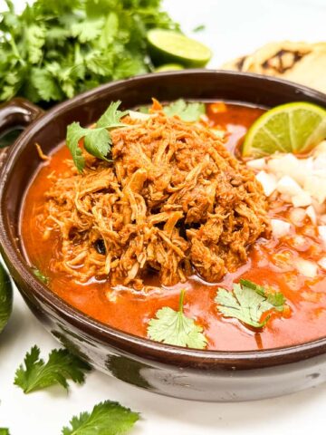 A close view of Chicken Birria (Birria de Pollo) in a dish.