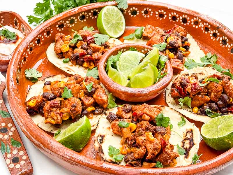 A Mexican platter of Southwest Chipotle Chicken Tacos.