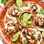 Looking down on a Mexican platter of Southwest Chipotle Chicken Tacos.
