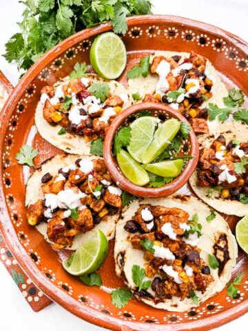 Looking down on a Mexican platter of Southwest Chipotle Chicken Tacos.