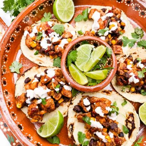 Looking down on a Mexican platter of Southwest Chipotle Chicken Tacos.