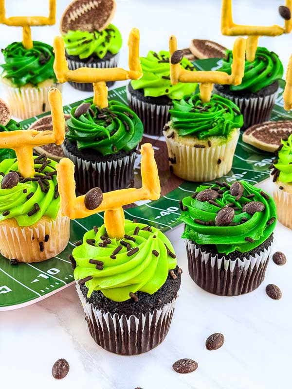 A collection of Touchdown Cupcakes grouped together on a table.