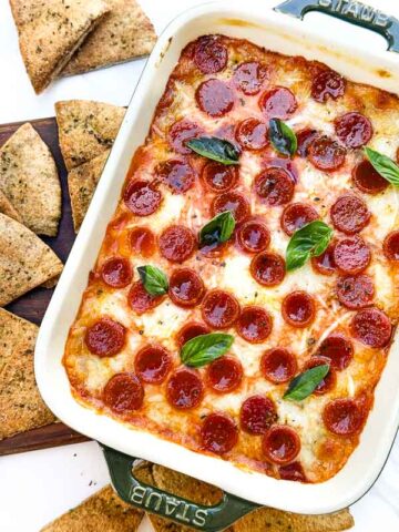 A closer view looking down on Pepperoni Pizza Dip in a small dish.